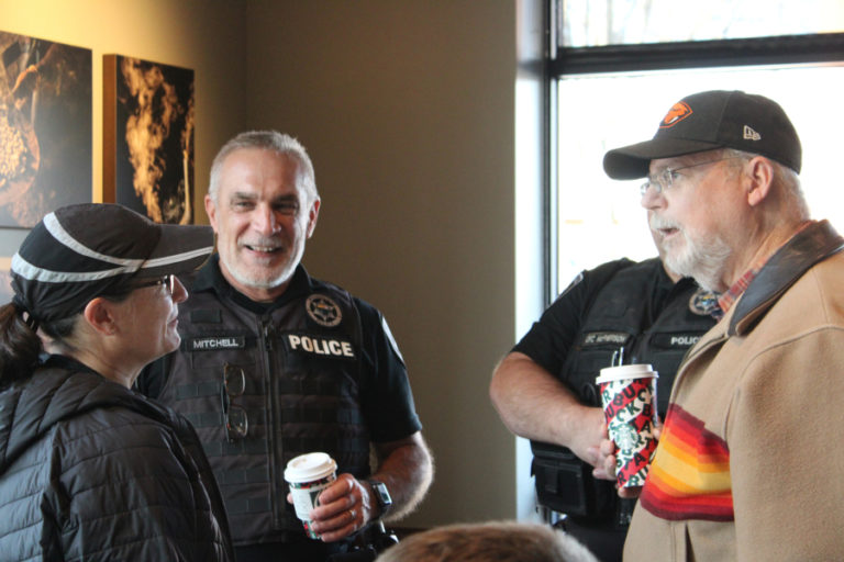 Washougal Police Chief Ron Mitchell (second from left) talks to Portland Police Commander Wendi Steinbronn (left), Camas Police Chief Mitch Lackey (second from right) and Washougal resident Bob Maddox (right) at the Nov. 22 &quot;Coffee with a Cop&quot; event at the Starbucks located at the corner of &quot;C&quot; and Third streets in Washougal. Steinbronn is set to replace Mitchell after the police chief retires at the end of November.