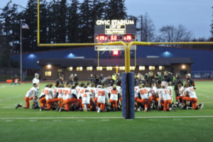 The Washougal High School football team gathers after losing to Lynden High School on Nov. 23 at Civic Stadium in Bellingham. (Contributed photo courtesy of Brad Brackett)