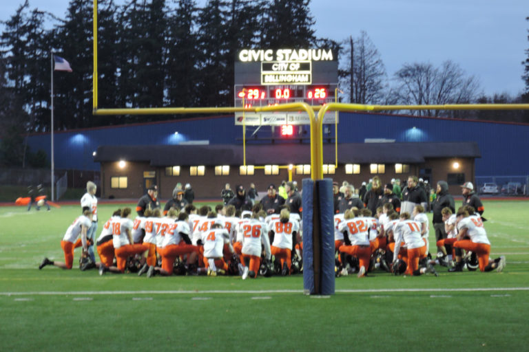 The Washougal High School football team gathers after losing to Lynden High School on Nov. 23 at Civic Stadium in Bellingham.