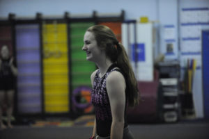 4A all-around state champion Shea McGee says she looks forward to the pressure that comes with trying to repeat this  season. (Photos courtesy of Camas High Sophomore Olivia Bane smiles after her bar performance in the Papermakers' first meet of the season in Battle Ground on Dec. 7.)