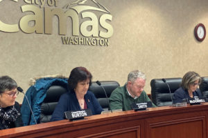 (Post-Record file photo) Camas City Council members Ellen Burton (left), Melissa Smith (second from left), and Shannon Roberts (right), and Mayor Barry McDonnell (second from right) prepare before the Dec. 2, 2019 city council meeting. The council voted this week to implement 