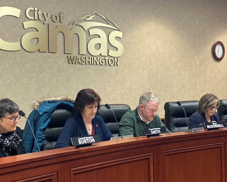 (Post-Record file photo) Camas City Council members Ellen Burton (left), Melissa Smith (second from left), and Shannon Roberts (right), and Mayor Barry McDonnell (second from right) prepare before the Dec. 2, 2019 city council meeting. The council voted this week to implement "phase one" cost-savings, including a hiring freeze on new and seasonal workers, to help the city of Camas withstand financial impacts of statewide closures meant to stem the spread of COVID-19.