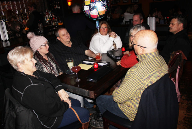 A group of people celebrate a birthday at Birch Street Uptown Lounge in Camas on Friday, Nov. 22.