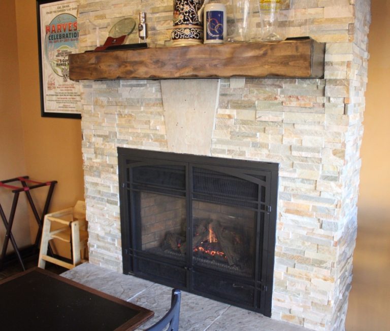 The fireplace at Mill City Brew Werks in downtown Camas is &quot;a draw,&quot; according to owner Mark Zech, pictured at right.