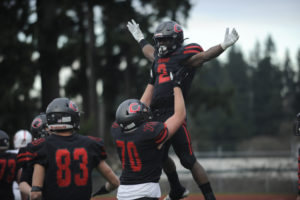 Camas High School running back Jacques Badolato-Birdsell can fly thanks to offensive tackle Rush Reimer in what's become a popular touchdown celebration. (Photos by Wayne Havrelly/Post-Record)