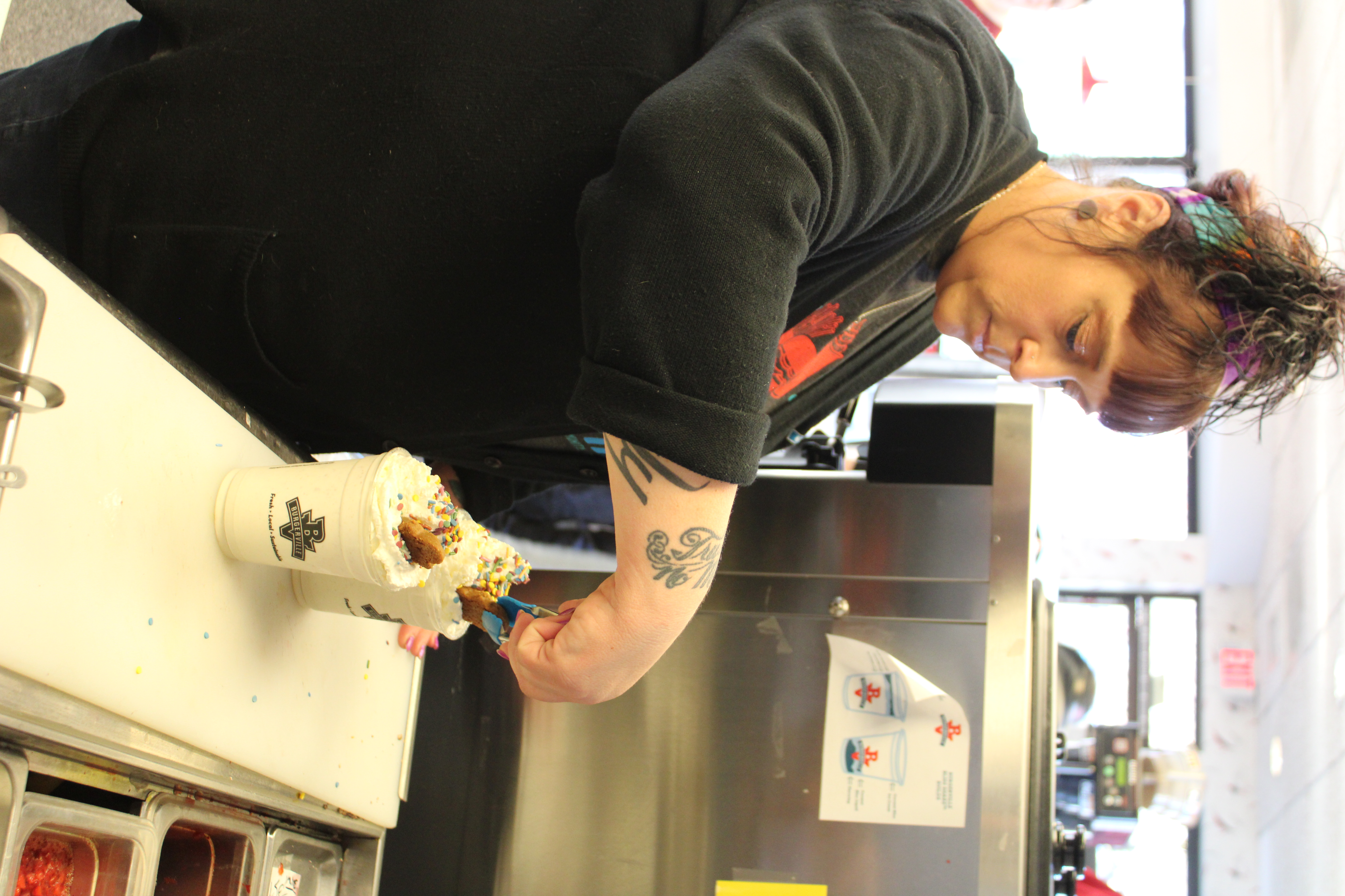 Shannon Lindberg, a team manager at the Vancouver Heights Burgerville, places a “gingerbread baby” on top of the company’s seasonal Gingerbread Shake, on Thursday, Dec. 5, at the Camas Burgerville on Northeast Third Avenue. The shake, which uses ingredients from a Camas couple’s McTavish Shortbread company, is available through the end of the month.