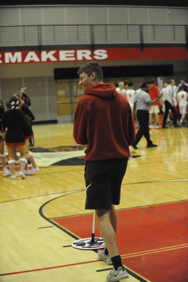 Senior Jackson Clemmer couldn&#039;t play in the Camas High School boys basketall team&#039;s home opener on Dec. 5 due to his particiation with the Papermakers&#039; football squad, but he was happy to help the basketball team with ballboy duties.