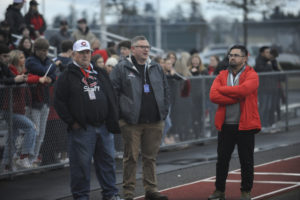 Former Camas mayor Scott Higgins (center) watches the Camas High School football team play for a 4A state championship at Mount Tahoma Stadium in Tacoma on Dec. 7. (Wayne Havrelly/Post-Record)