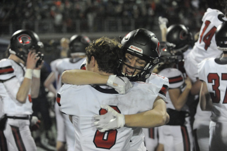 Camas High School seniors Charlie Bump and Martin Knysh share an emotional moment following the Papermakers&#039; state championship victory over Bothell High School on Dec. 7.