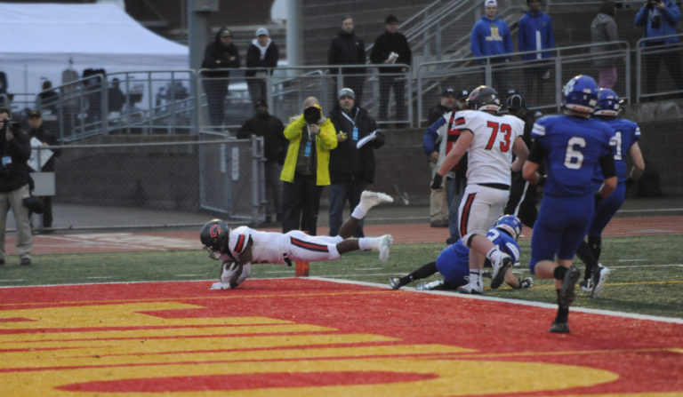 Camas High School&#039;s Jacques Badolato-Birdsell flys head-first into the end zone for his second of three touchdowns in the 4A state championship game on Dec. 7.