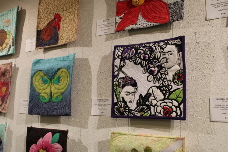 "In Frida's Garden," a quilt by Audrey Prothero  showcasing Mexican painter Frida Kahlo, hangs on the wall at the Second Story Gallery on the second floor of the Camas Public Library in downtown Camas. The quilt is part of the gallery's two-month “Whispers in the Wind” show.