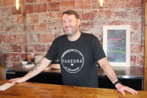 (Post-Record file photo) Ryon Morrison left a 20-year career in aviation to start a delicatessen in downtown Washougal. Taberna NW opened for business in November 2019, but is struggling to remain viable during the statewide COVID-19 social-distancing measures, which have closed all in-person dining at Washington's restaurants and bars. 