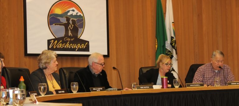 Washougal City Councilman Ernie Suggs (right) nominates Molly Coston (second from left) to continue as the city&#039;s mayor at a Jan. 13 city council meeting.