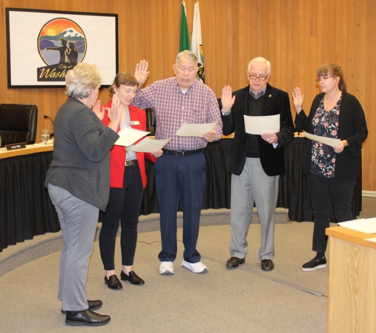 Washougal Mayor Molly Coston (left) administers oath-of-office statements to city council members (from second to left to right): Alex Yost, Ernie Suggs, Ray Kutch and Michelle Wagner at a Jan. 13 meeting. Yost, Suggs, Kutch and Wagner won their bids for re-election during the November 2019 general election.