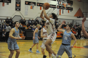 Washougal freshman Yanni Fassilis (center, front) drives towards the basket during the Panthers' Jan. 13 game against Hockinson. (Photos by Wayne Havrelly/Post-Record)