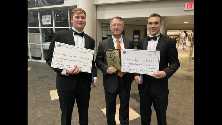 Washougal football players Tommy Liston (left) and Brevan Bea (right), along with Panthers coach Dave Hajek (center), display their awards during the Clark County Chapter of the National Football Foundation and College Hall of Fame awards banquet on Jan. 16 at Hudson&#039;s Bay High School.