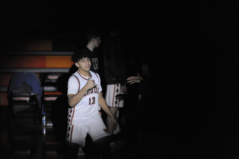 A spotlight shines on Washougal freshman Yanni Fassilis during the Panthers&#039; Jan. 13 home game.