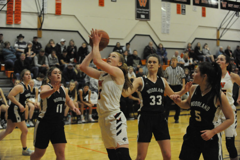 Washougal sophomore Savea Mansfield drives for a basket against Woodland earlier this season. Mansfield has become a key scorer for the Panthers in her second year with the defending state champions.