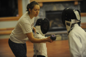 Fencing instructor Julia Tikhanova instructs her young students earlier this month at Lacamas Lake Lodge in Camas. (Photos by Wayne Havrelly/Post-Record)