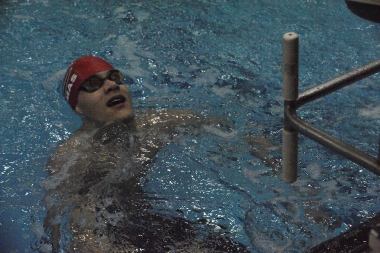 Camas senior Ben Taylor catches his breath after winning a 100-meter freestyle preliminary race at the District 4 championship meet in Kelso on Feb. 7.