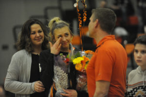 Washougal senior McKinley Stotts (center) is honored at halfcourt with her family members before the Panthers' final home game of the regular season on Feb. 10. 