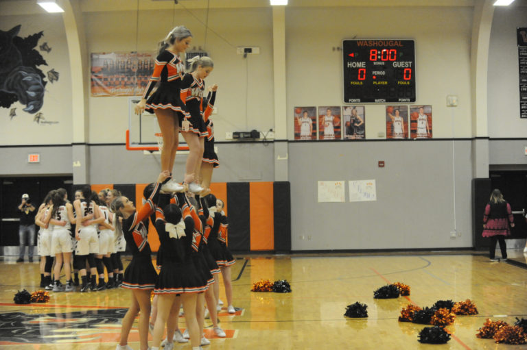 The Washougal cheer squad pumps up the crowd prior to the Panthers&#039; girls basketball team&#039;s final league game of the season against R.A. Long on Feb. 10.