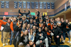 Washougal wrestlers celebrate a double victory as the Panthers' boys and girls teams won sub-district titles on Feb. 7-8 at Hockinson High School. (Contributed photo courtesy Heather Carver)