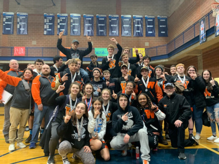 Washougal wrestlers celebrate a double victory as the Panthers&#039; boys and girls teams won sub-district titles on Feb. 7-8 at Hockinson High School.