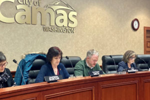 Camas City Council members Ellen Burton (left), Melissa Smith (second from left) and Shannon Roberts (right) listen to citizen comments with Camas Mayor Barry McDonnell at a December 2019 city council meeting. (Kelly Moyer/Post-Record)