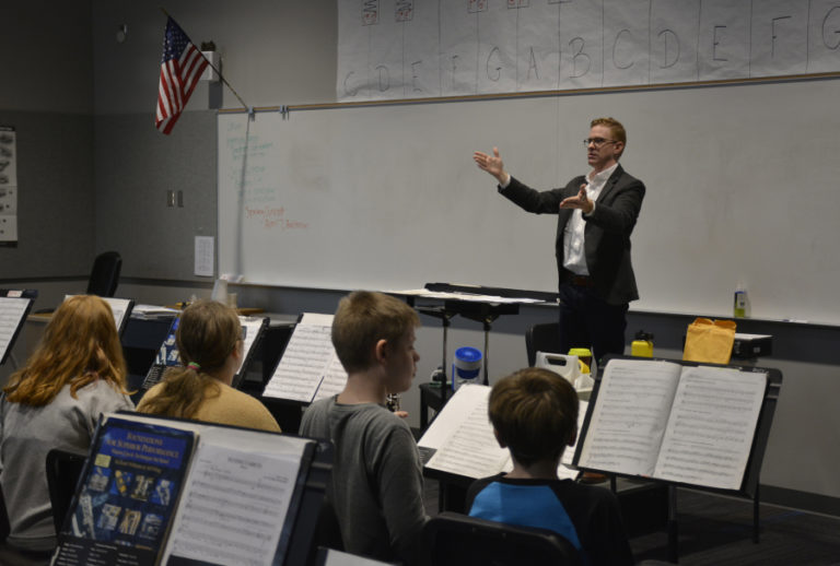 David Wacyk, assistant professor of music and director of bands at Saint Martin&#039;s University, speaks to Jemtegaard Middle School music students on Feb.