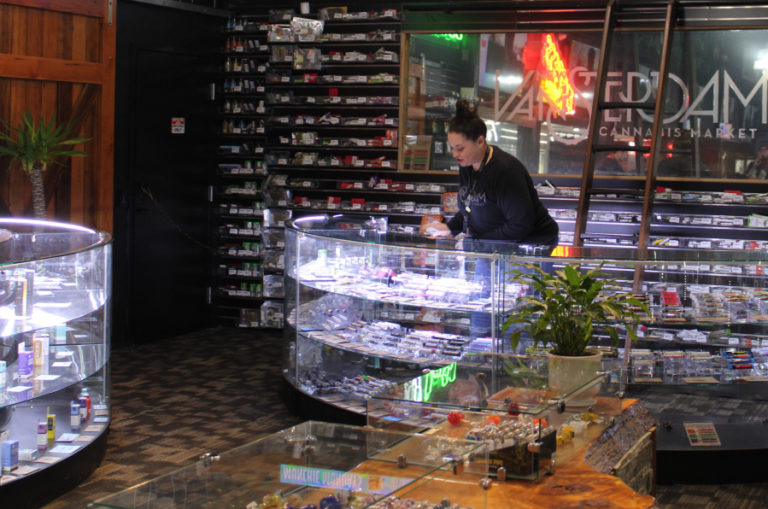 Christina Koehler works behind the &quot;pre-rolled&quot; cannabis products counter at the Vancouver-based New Vansterdam cannabis shop on Tuesday, Feb. 25.