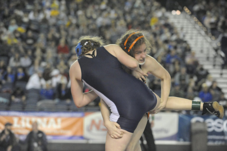 Washougal&#039;s Aleksi Donahue (right) wrestles an opponent at Mat Classic XXXII in Tacoma on Feb. 21. Donahue took fourth place at 120 pounds.