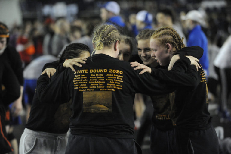 Washougal wrestlers give each other a pep talk prior to the first round of Mat Classic XXXII in the Tacoma Dome.