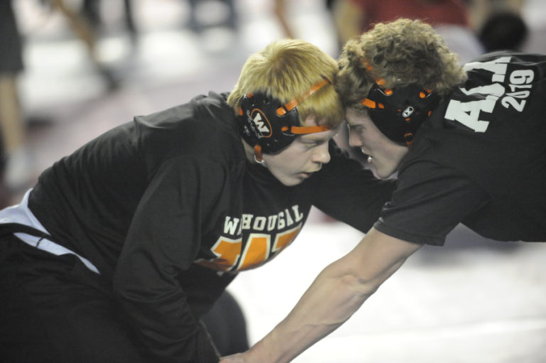 Washougal&#039;s Scott Lees (left) warms up with teammate Aiden Kestner at Mat Classic XXXII in Tacoma. Lees finished fourth in the 152-pound weight class.
