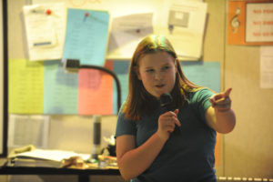 Canyon Creek Middle School sixth-grade student Maeve Norton sings a song during a karaoke event for 100 Percent Day on Friday, March 6. (Photos by Wayne Havrelly/Post-Record)