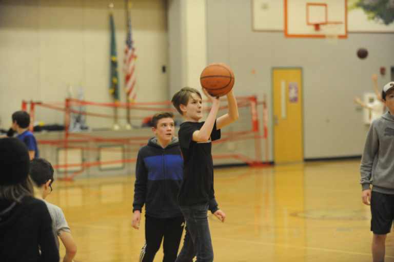 Wayne Havrelly/Post-Record 
 Canyon Creek Middle School students play basketball during a 100% Day activity on Friday, March 6.