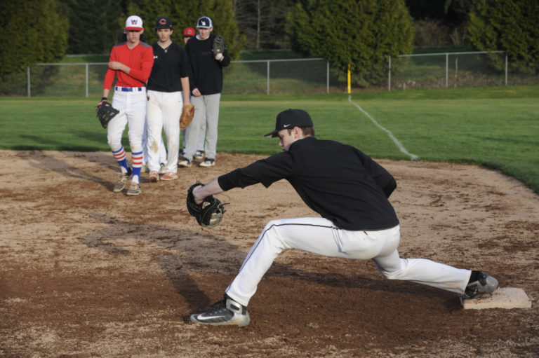 Camas senior Riley Sinclair practices his first-base skills  at a recent practice session. Sinclair is also the Papermakers&#039; No. 1 pitcher this season.