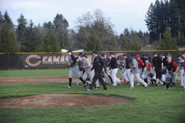 Camas baseball players run off the field during one of their first practices of the season.