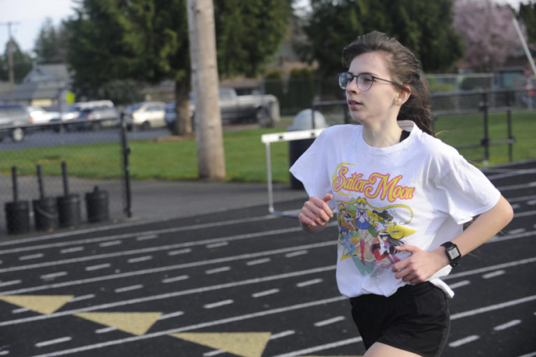 Washougal High freshman long-distance runner Sidney Boothby works on her form during a recent practice session.