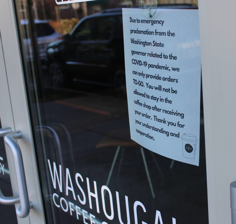 A sign on the front door of Washougal Coffee Company on Monday, March 16, informs customers about the business’ plans to offer “to-go” service.
