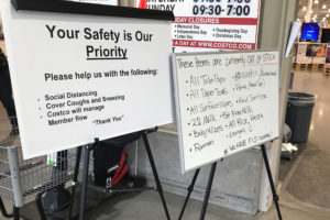 Signs in front of Camas’ Costco tell customers about the store’s safety procedures and out-of-stock items on Friday, March 13.