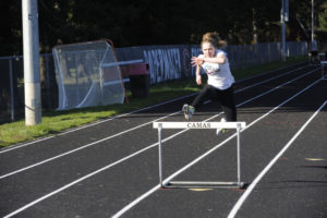 Camas freshman hurdler Kit Greenhill practices at Cardon Field on Thursday, March 12. (Photos by Wayne Havrelly/Post-Record)