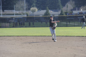 Washougal second baseman Trenton Hamilton throws to first base during a March 12 practice session at Washougal High School.