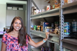 (Photo by Kelly Moyer/Post-Record) Olivia Eagle, with the Camas School District, shows a cabinet filled with non-perishable food in September, at the district's Family Community Resource Center. Donations are needed to help stock the resource center and assist vulnerable families during the COVID-19 closures.