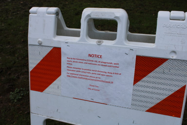 (Kelly Moyer/Post-Record) A notice posted at Crown Park in Camas lets the public know the playground and other park facilities are closed due to the COVID-19 pandemic. The city is planning a phased approach to reopening its city parks, beginning Tuesday, May 5, with the reopening of parking lots at city parks and trailheads, and the reopening of restroom facilities at Heritage Park.