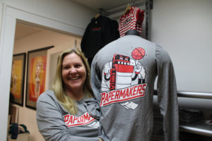 (Post-Record file photo)
Karen Gibson, co-owner of Papermaker Pride, shows some of the downtown Camas shop's Camas-themed clothing in December 2019. Papermaker Pride has launched a #CamasUnites campaign to help support at-risk Camas students and families during the COVID-19 pandemic. 