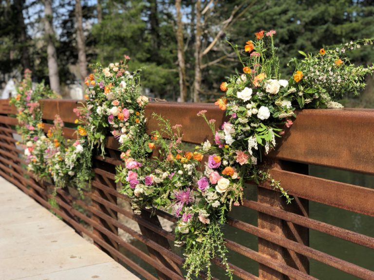 (Photo courtesy of Janessa Stoltz) 
A flower installation, courtesy of Acorn & the Oak owners Chuck and Janessa Stoltz, decorates the pedestrian bridge near Lacamas Park in Camas.