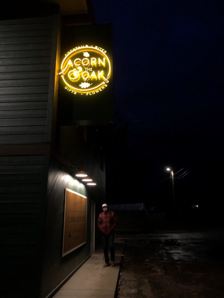(Photo courtesy of Janessa Stoltz) 
Chuck Stoltz, co-owner of Acorn & the Oak, stands under the business' sign at 3533 N.E. Everett St., in Camas.