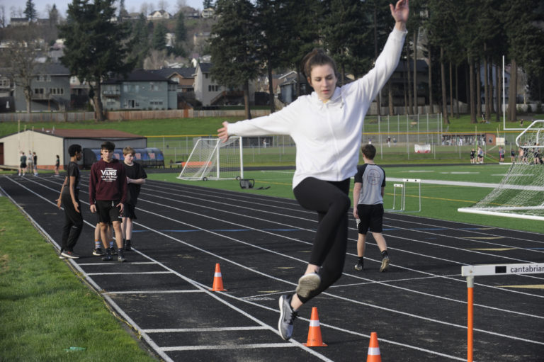 Washougal High senior Gracie Dolan practices her take-off in the long jump at a practice session last month.