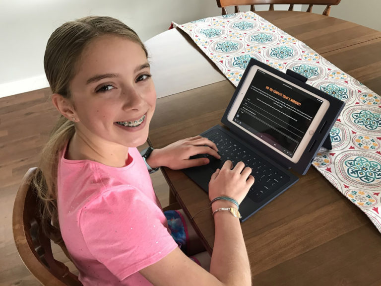 Jemtegaard Middle School sixth-grader Gracie Perry records information from a workoout session to a website for the school&#039;s virtual track and field program.